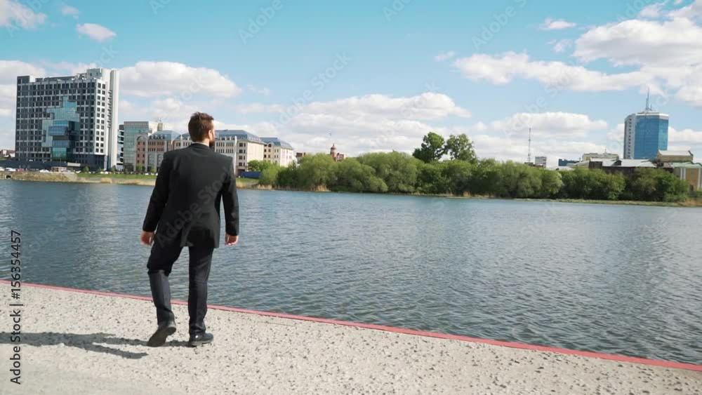 Businessman with brave rejoice and fortunate and lucky of win. He looks prosperous in suit and tie outdoor. Modern building background. Businessman with brave rejoice and fortunate and lucky of win. He looks prosperous in suit and tie outdoor. Modern building background.
