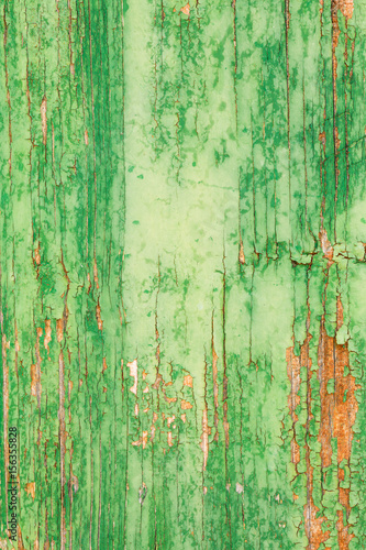 aged wooden plank with decayed green paint texture