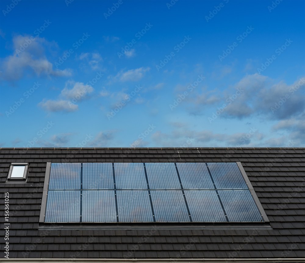 Fototapeta premium Solar Panels on roof of English Style Architecture House, UK
