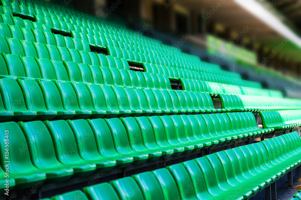 Fototapeta premium Green plastic seats at stadium