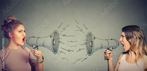 Quarrel between two women screaming at each other in megaphone