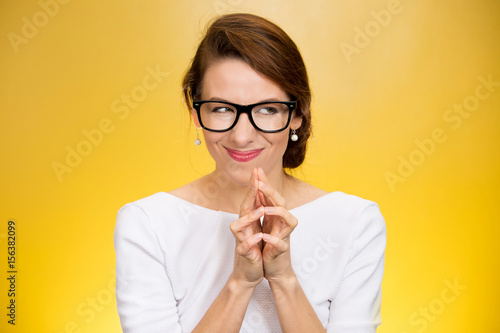 crazy looking sly woman in black glasses