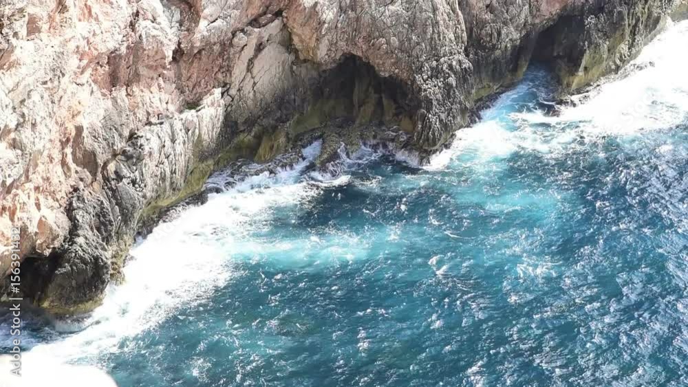 Rocks and blue water in Capo Caccia shore Rocks and blue water in Capo Caccia shore