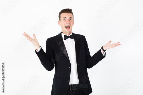 Young man master performing on the stage. Man in blue suit on white background with copy space