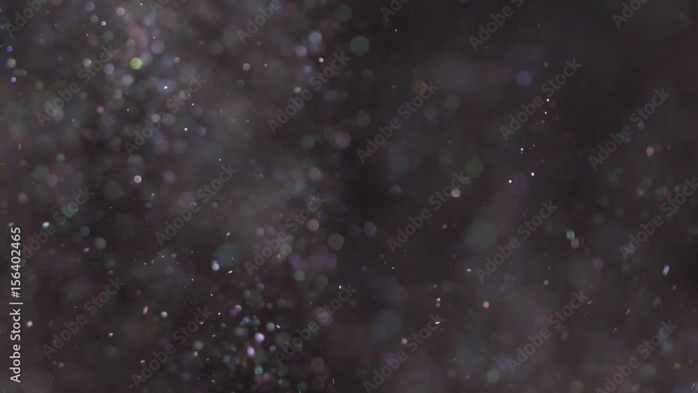 Beautiful shimmer flying on the black background, abstract slow motion Beautiful shimmer flying on the black background, abstract slow motion