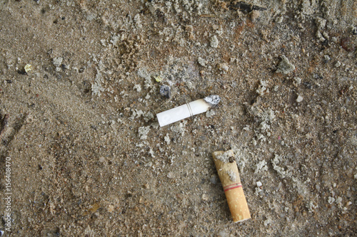 Cigarette butts in the sand
