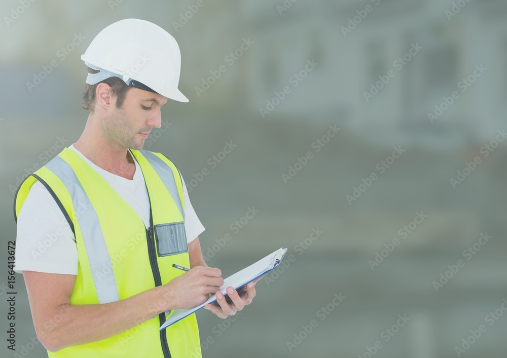 Construction Worker in front of construction site Construction Worker in front of construction site