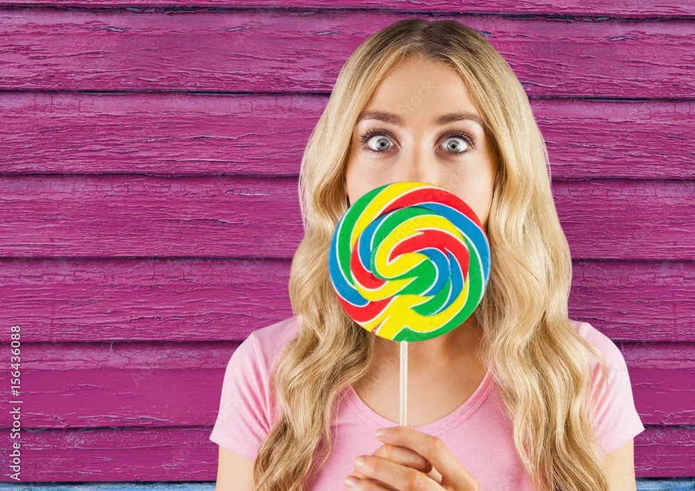 hipster  with lollipop with pink wood background