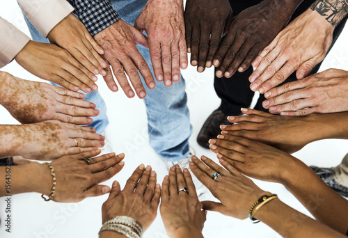 Tablou pe pânză Group of hands assemble in aerial view