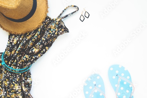 Flat lay of woman dress with accessories and sandals on white background, Beauty and beach items concept
