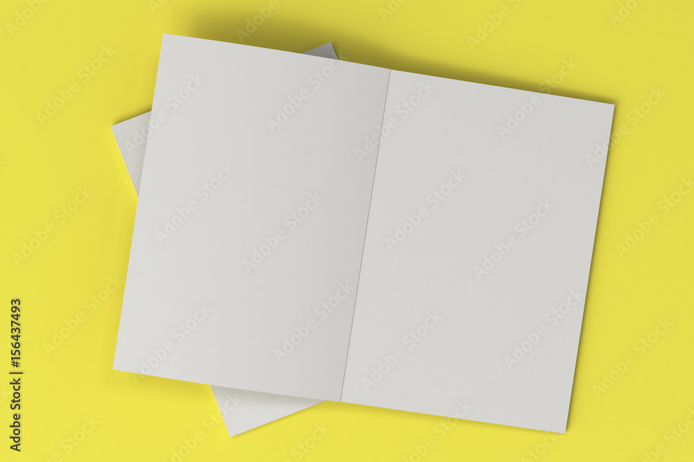 Two blank white open brochure mock-up on yellow background Two blank white open brochure mock-up on yellow background