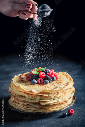 Sweet pancakes cake with blueberries and raspberries