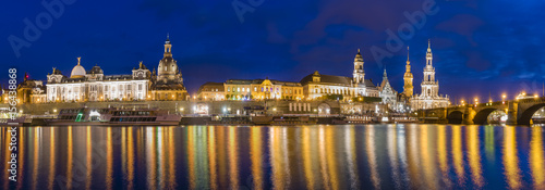 Night view of the historic part of Dresden, city lights reflecting on the River Elbe