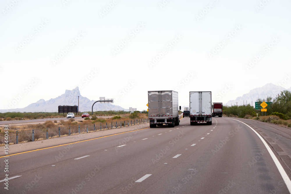 Arizona highway traffic with semi trucks trailers