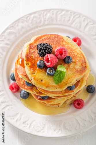 Tasty american pancakes with blueberries and raspberries