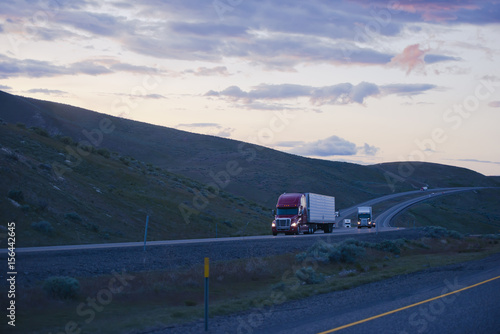 Evening road with semi trucks going uphill in Columbia Gorge © vit