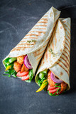 Healthy grilled tortilla with chicken, tomatoes and lettuce