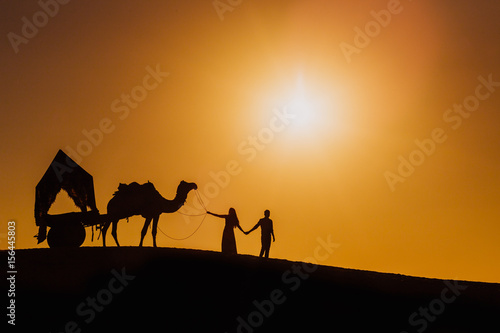 Couple pic with camel in desert