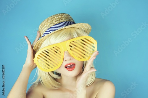 Playful girl with funny glasses, Happy naughty blonde hair woman with Large funny glasses. Party time. photo