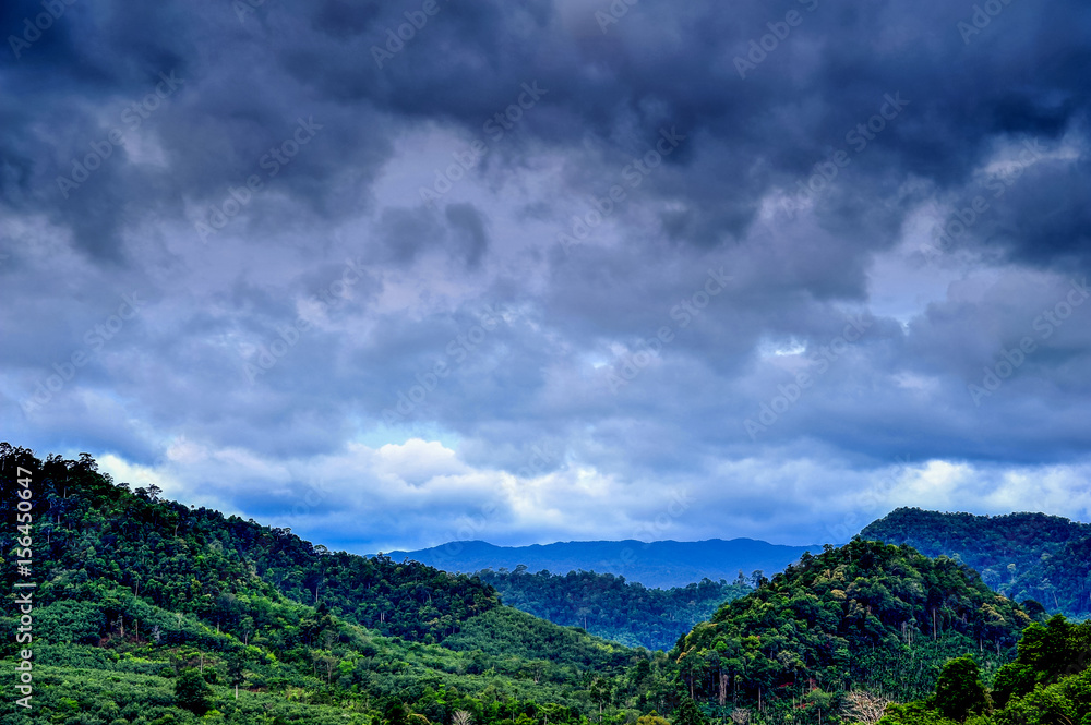 Rural view of mountain with rainy cloud