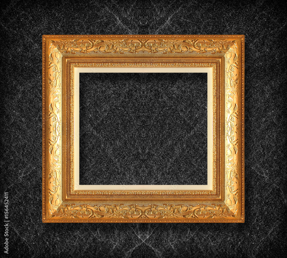 Fototapeta premium gold frame on black slate background