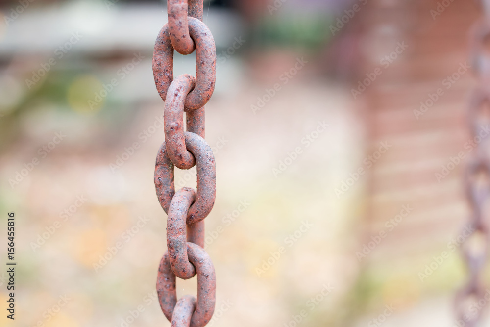 Old red brown rust iron chain with blurred and bokeh background Old red brown rust iron chain with blurred and bokeh background