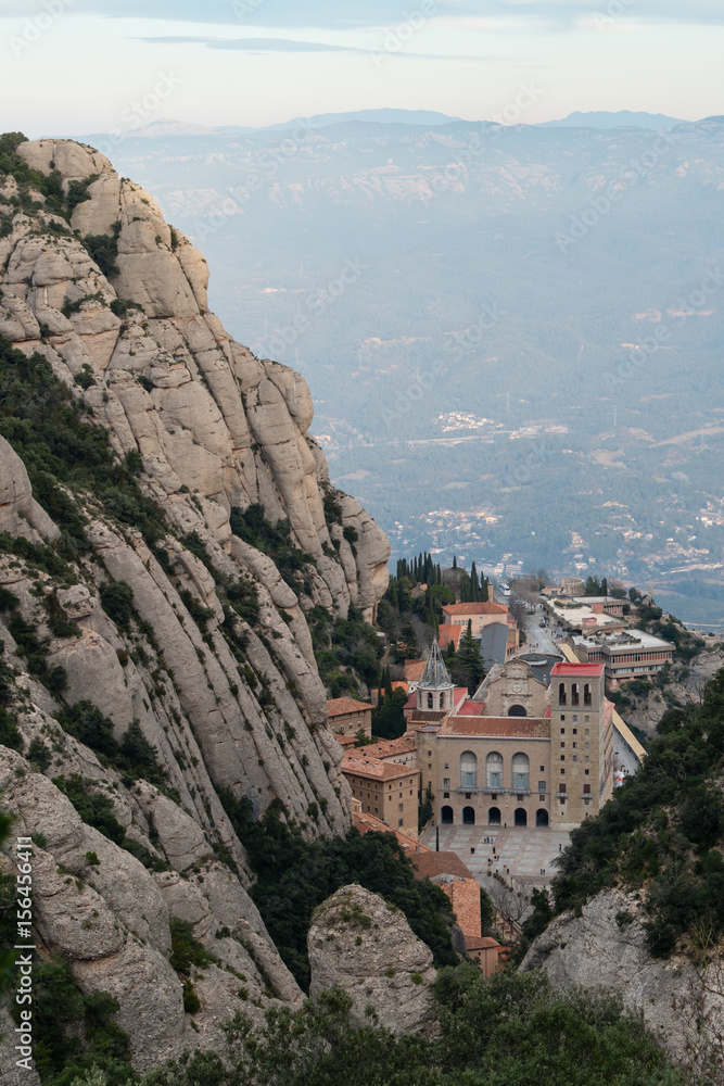 Above view of the Monastery of Montserrat, Spain, from the top of the mountain through the canyon on sunset.