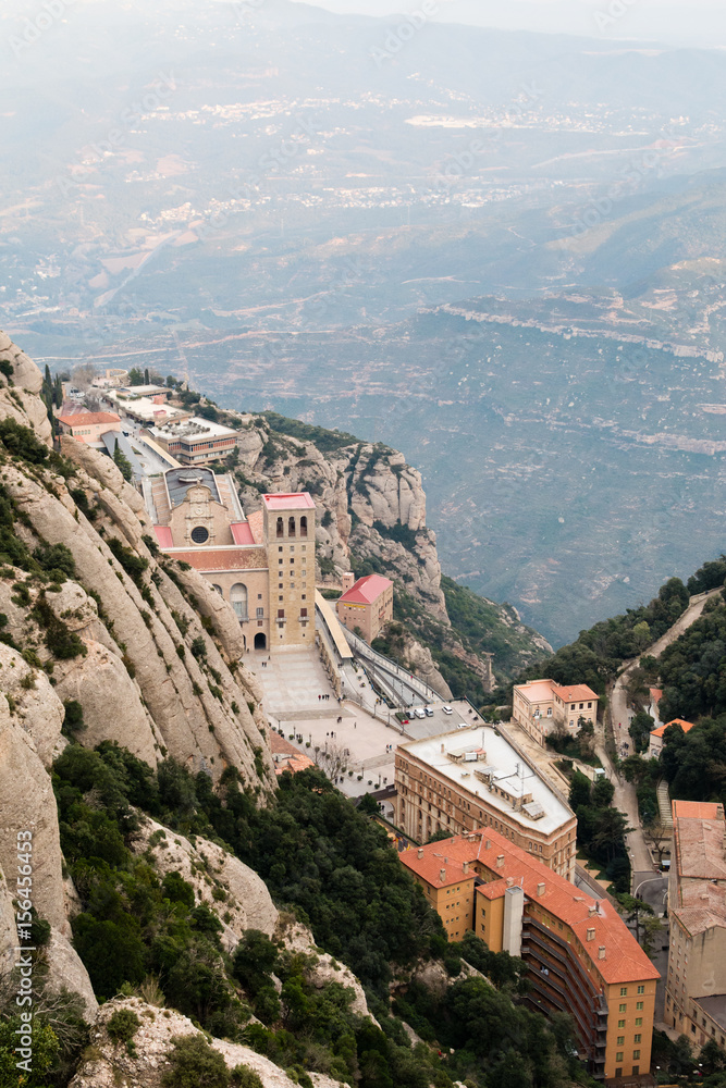 Above view of the Monastery of Montserrat, Spain, from the top of the mountain through the canyon on sunset.