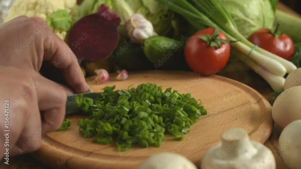 Cooking. Cutting green onions Cooking. Cutting green onions