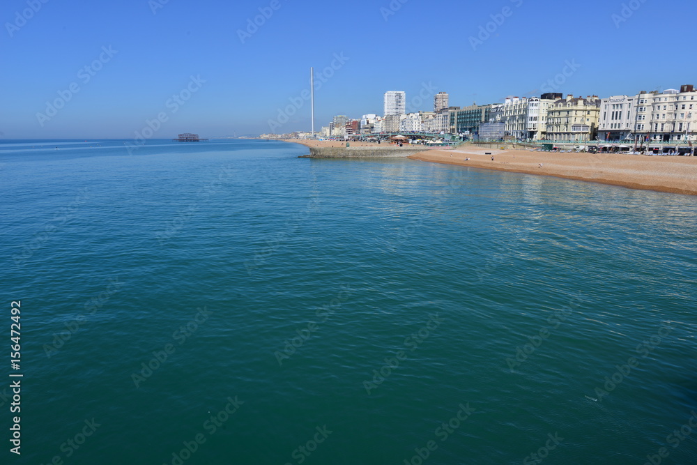 The coast of Brighton on a hot day in May.
