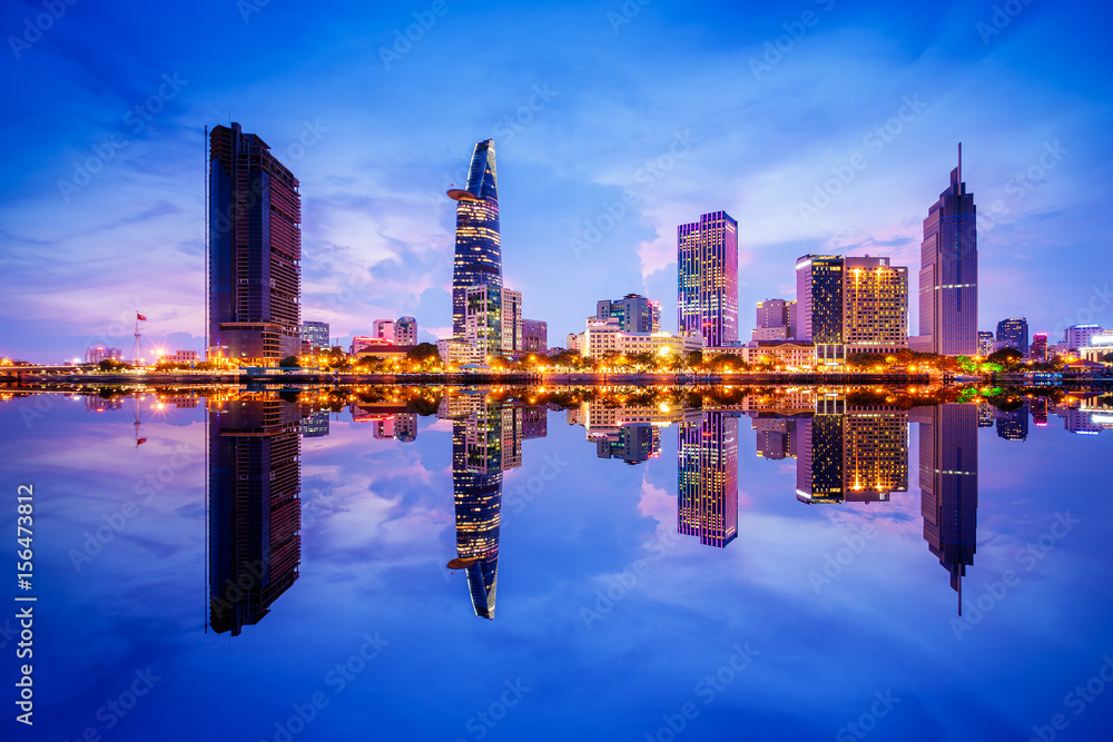 Cityscape in reflection of Ho Chi Minh city at beautiful twilight