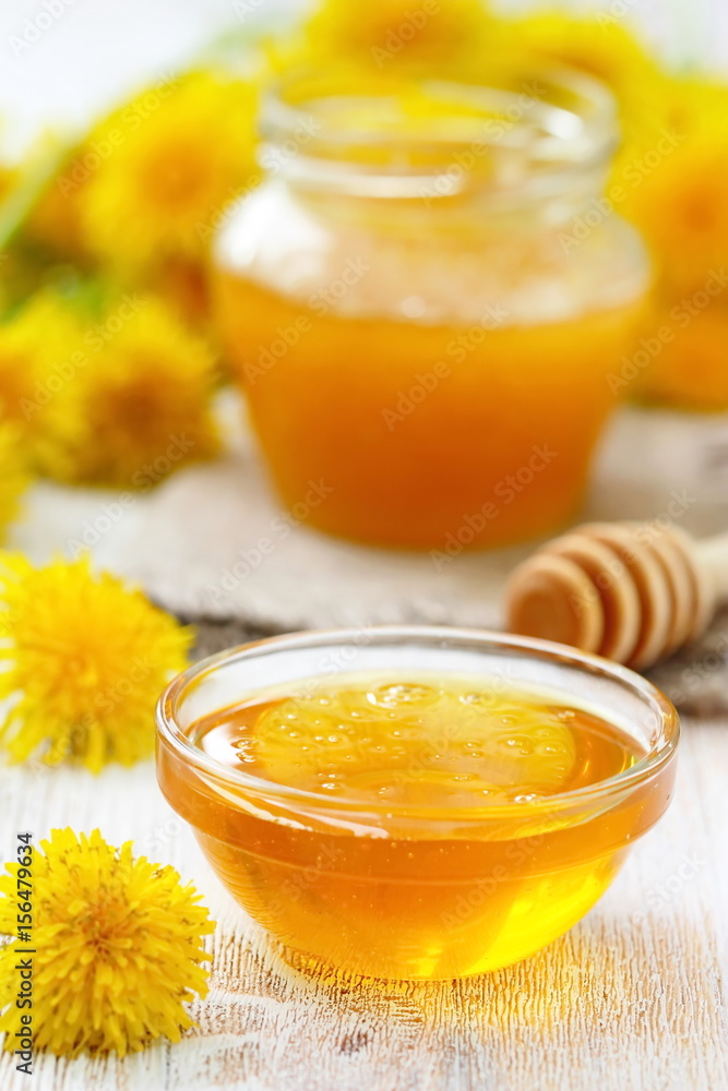 Flower honey in glass bowl Flower honey in glass bowl