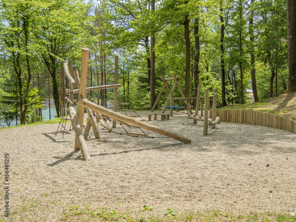 childrens playground in forest. sandy ground childrens playground in forest. sandy ground