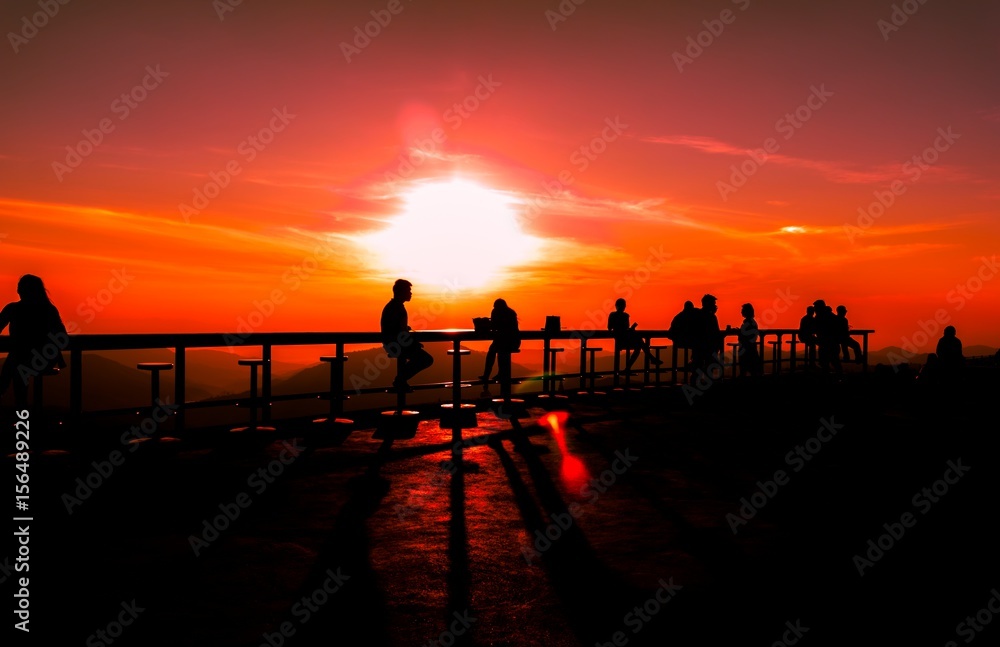 Many tourists watch the morning sunrise on the mountain.