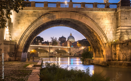 Photography Picturesque view on Saint Peter's cathedral under the bridge of Angels, Rome Ita