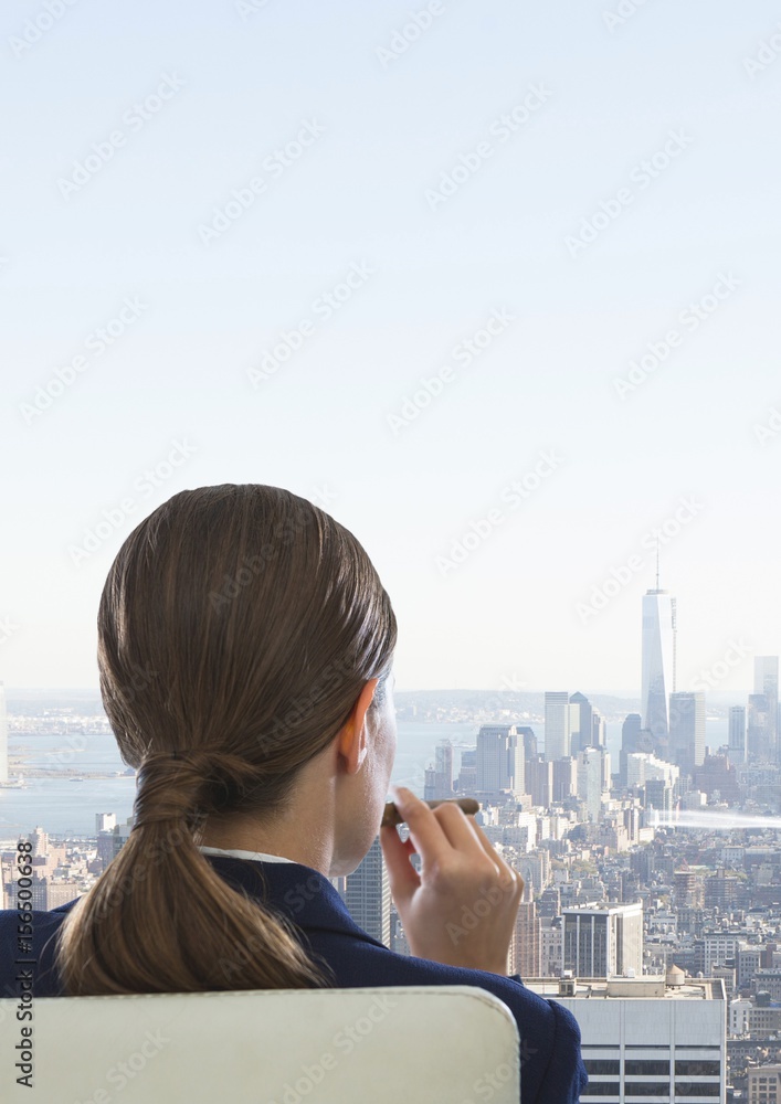 Rear view of businesswoman sitting on chair Rear view of businesswoman sitting on chair
