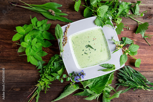 Selbstgemachte Suppe aus heimischen Wildkräutern (Wiesenkräutern) photo