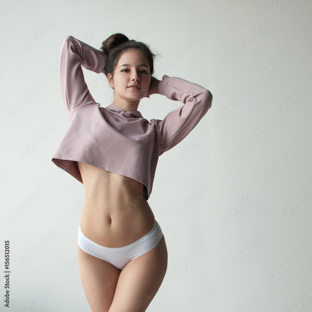 pretty girl with cute face posing in crop top and white pantie Stock Photo