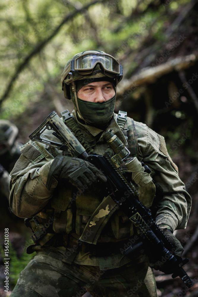 Fototapeta premium Photo of soldier in camouflage