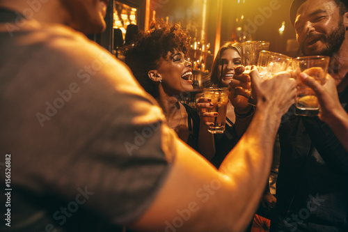 Young friends at nightclub having party