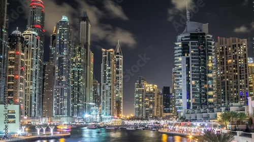 View of Dubai Marina Towers and canal in Dubai night timelapse hyperlapse photo