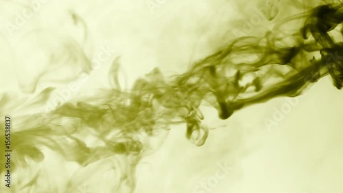 Vapor like smoke at radioactive olive in white background. Vape smoke rings in motion at vape clouds.