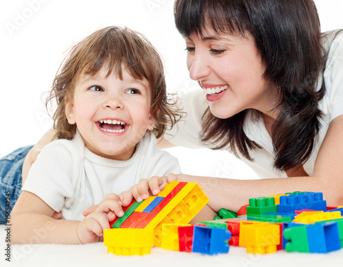 Mother and baby playing and smiling. Happy family.