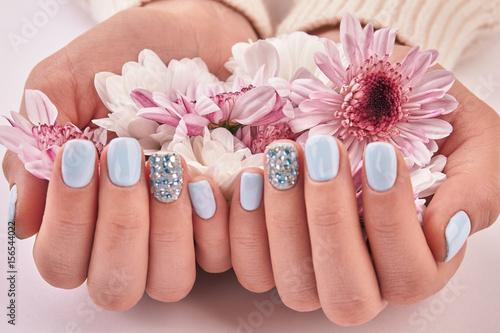 White and pink chrysanthemums, gentle decoration for manicure.