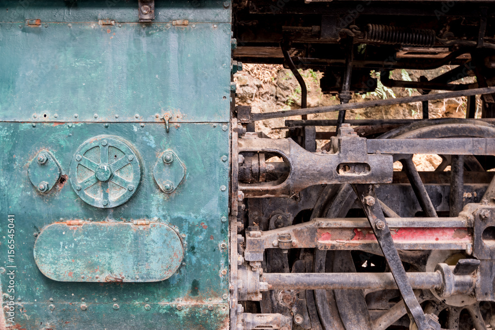 Steam locomotive wheels and mechanics closeup