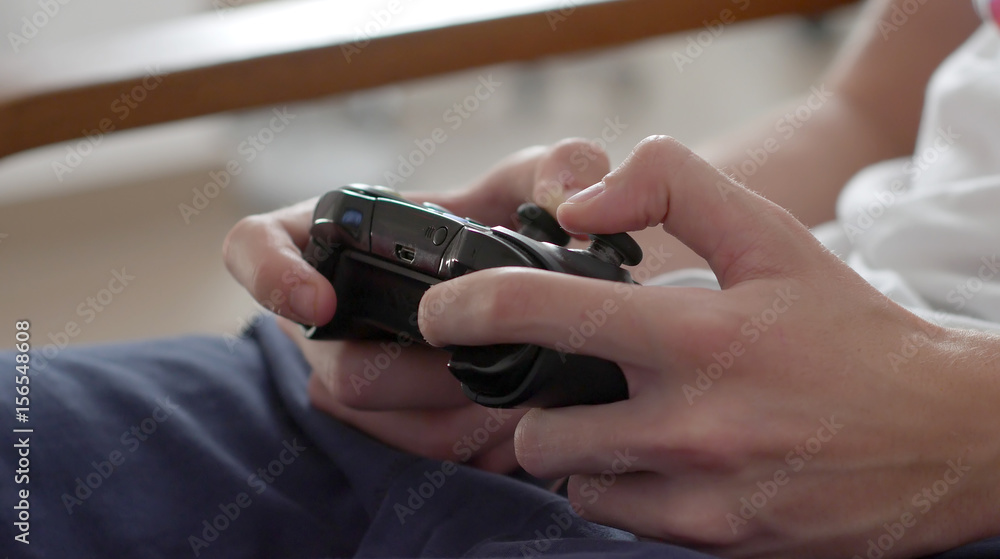 Close up of boy hands using game controller, in the end throwing the controller, angry close up Close up of boy hands using game controller, in the end throwing the controller, angry close up