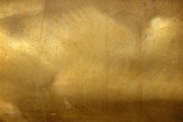 Shiny yellow leaf gold foil texture background