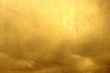 Shiny yellow leaf dark gold foil texture background