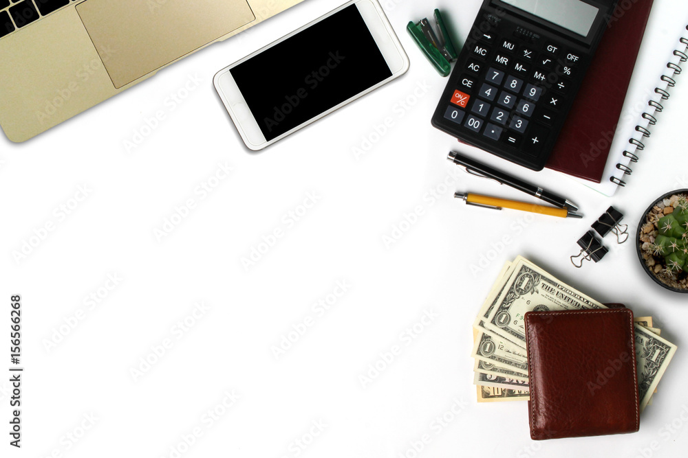 White office desk with smartphone with black screen, pen, laptop computer, wallet, and supplies. Top view with copy space White office desk with smartphone with black screen, pen, laptop computer, wallet, and supplies. Top view with copy space