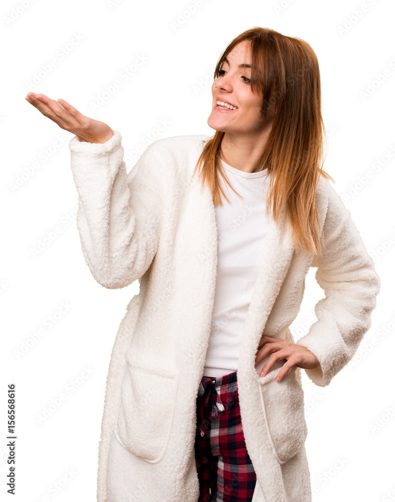 Young woman in dressing gown holding something Young woman in dressing gown holding something